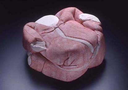 red plaster reconciled baby sculpture